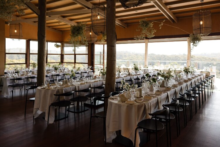 Barn wedding reception with long tables at Mimosa Wines