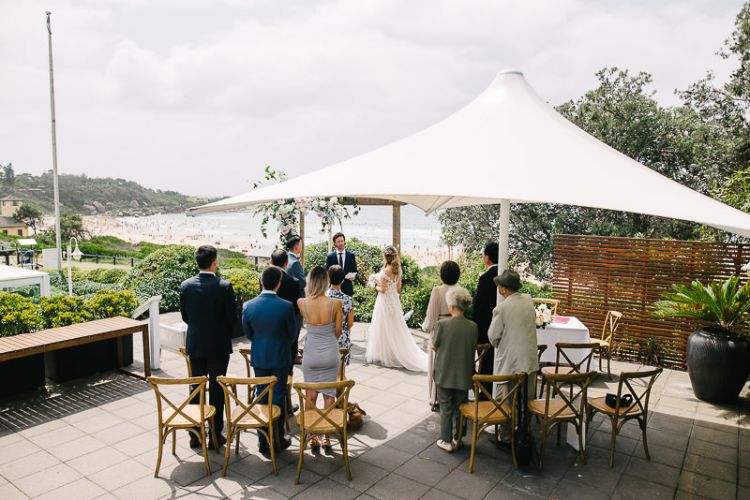 Beachfront wedding ceremony on Pilu's garden terrace in Sydney