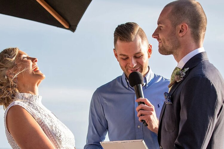 Funny marriage celebrant Benn Stone with laughing Bride & Groom