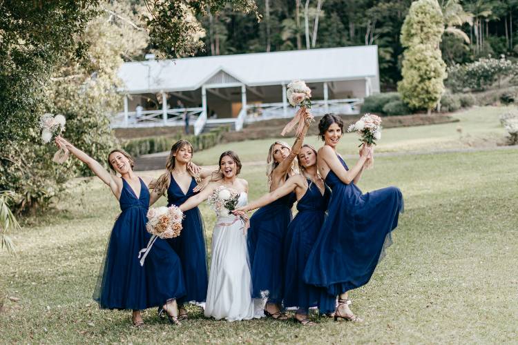 Bridal party at Nightcap Ridge with wedding accommodation in background