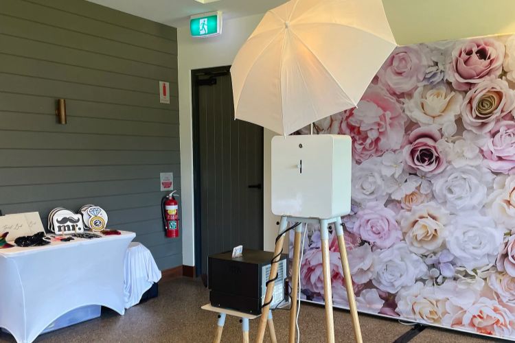 Central Coast photobooth with floral backdrop