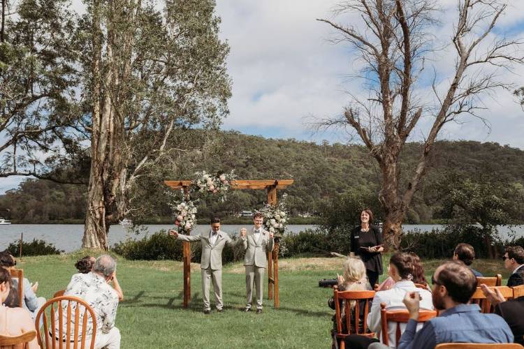 Hawkesbury River wedding ceremony with grooms at Wisemans Retreat