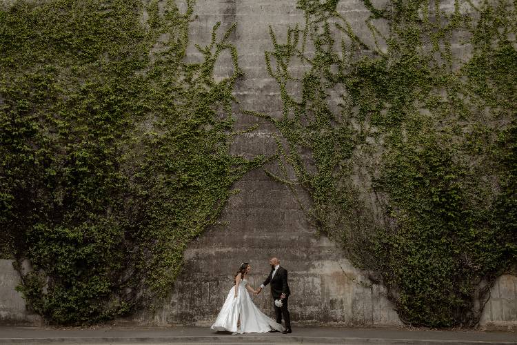 Couple portrait against ivy wall at Hickson Rd Reserve by Sarah Van Treel