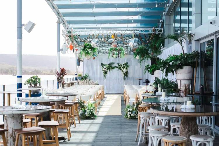 Waterfront wedding ceremony space at affordable venue Drifters Wharf