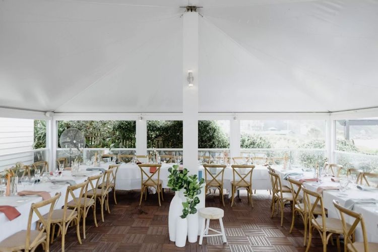 Pavilion-style marquee wedding reception setup at Pilu overlooking the ocean