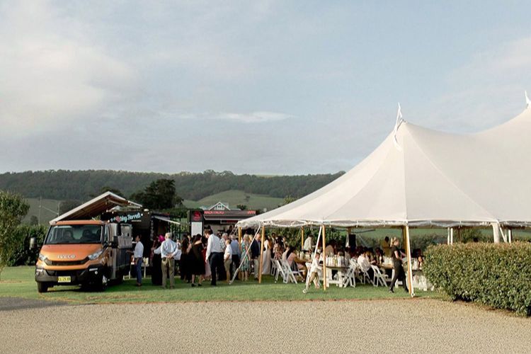 Mexican food truck Cantina Movil serving a marquee wedding reception