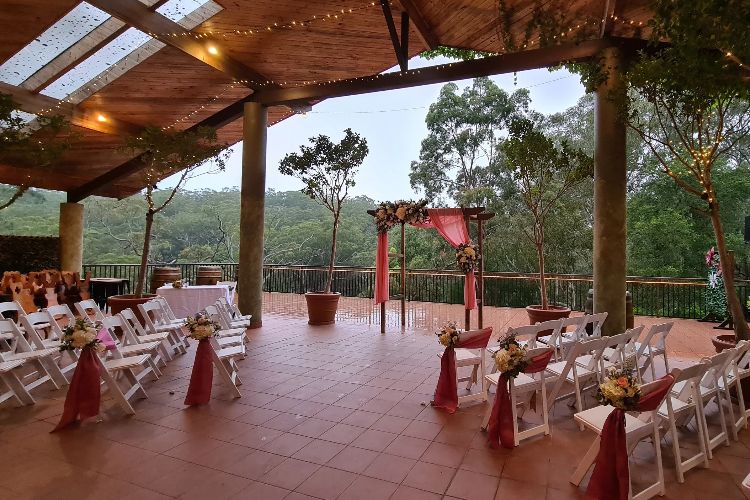 Open-air wedding ceremony in Allegro's treetop terrace bar
