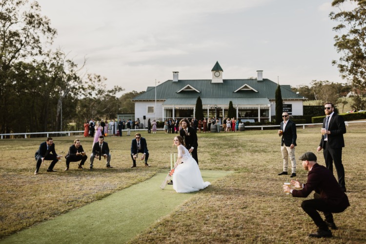 Bride & Groom playing cricket at Hunter Valley wedding venue Wandin Valley