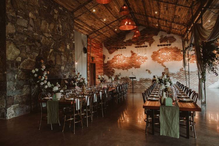 Rustic barn wedding venue with romantic lighting at Petrichor Farm