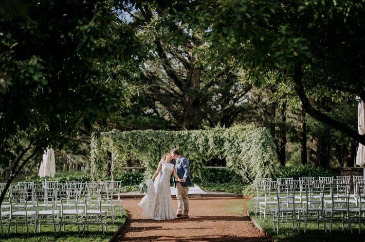 Regional wedding venue with lush garden arbour in orchard at Sylvan Glen Estate