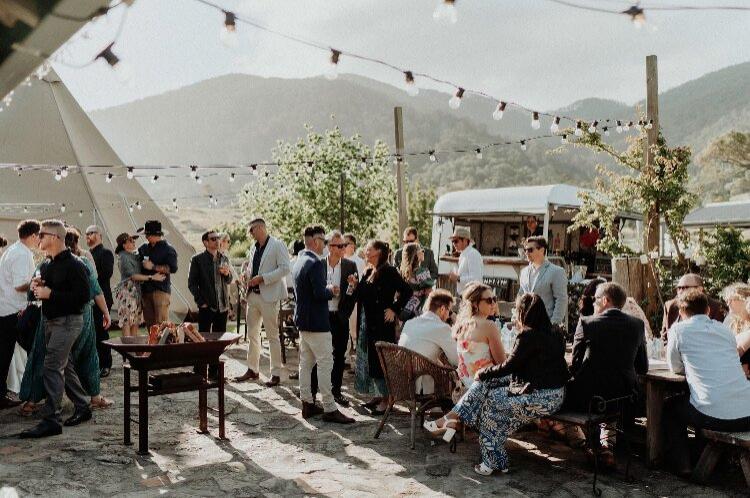 Rustic farm wedding venue in a repurposed cow shed with mountain views
