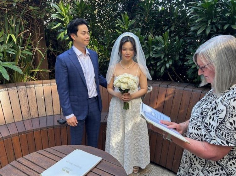Simple elopement ceremony by Margaret Janz in her home garden