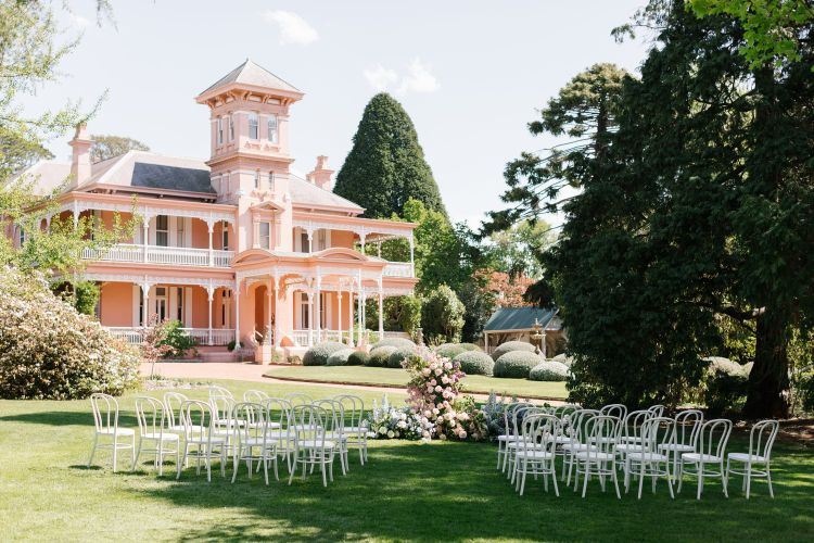Formal garden wedding ceremony at Retford Park in Bowral with heritage house