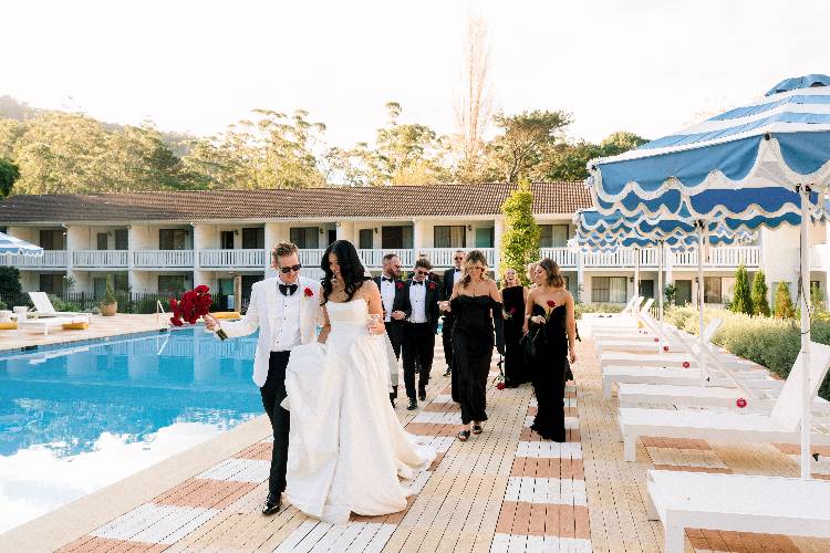 Bridal party relaxing by the pool and accommodation at The Lodge Jamberoo